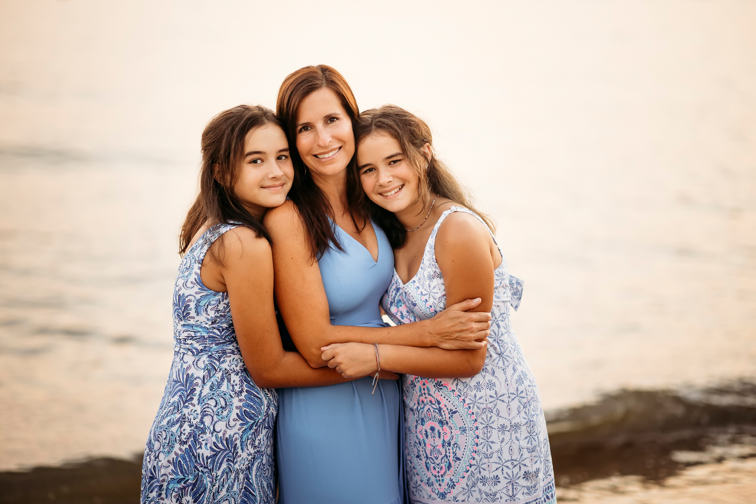 mom in blue dress hugging her two girls, CT Family photographer, posing tips for mom