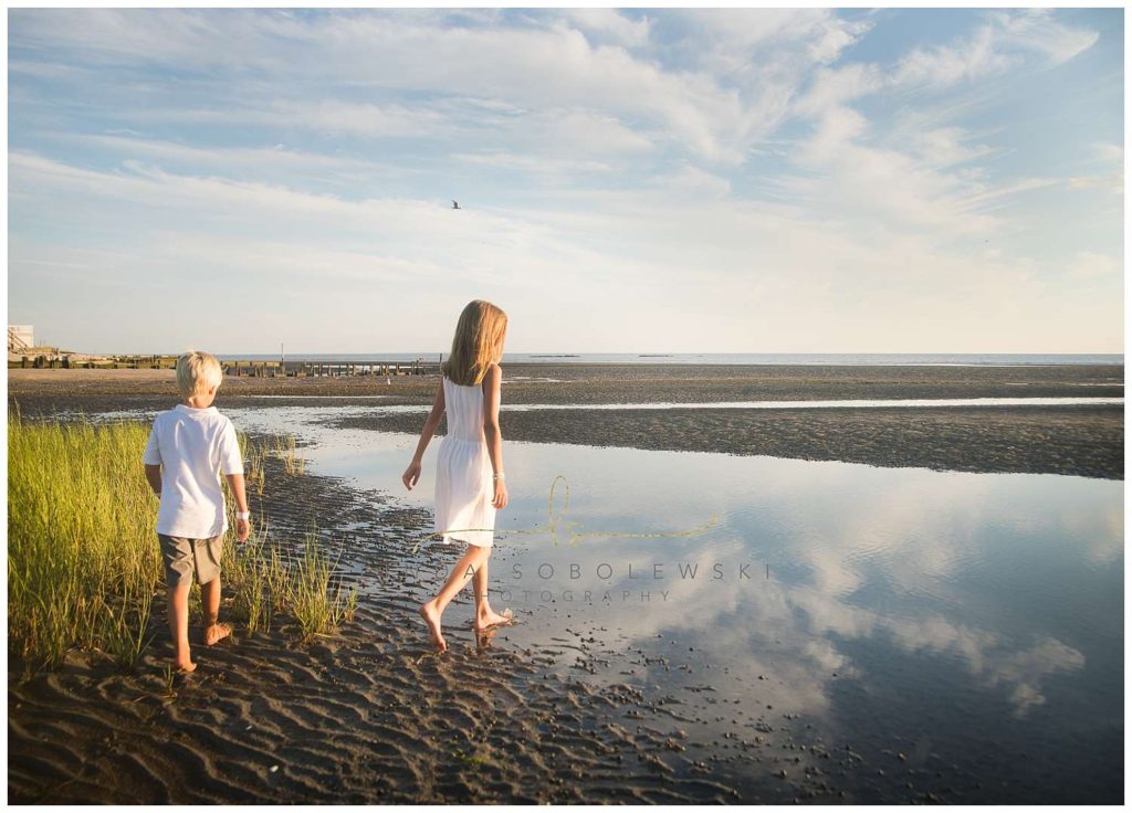 boy and girl at beach, reflection in water, old saybrook, ct