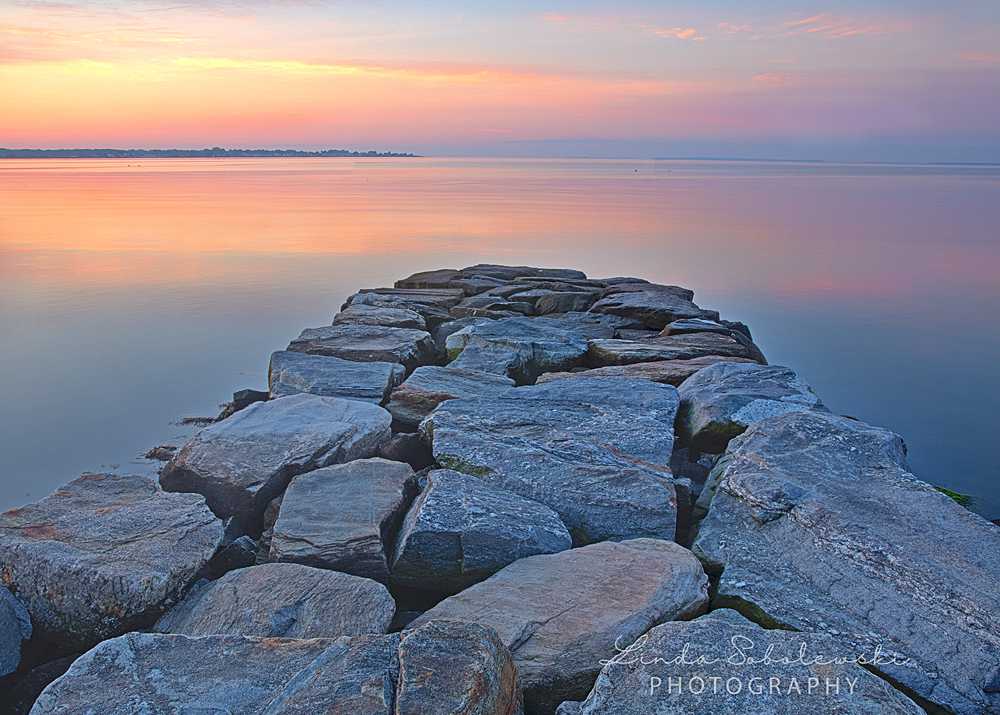 pink sunrise over rocky jetty, Westbrook CT family photographer