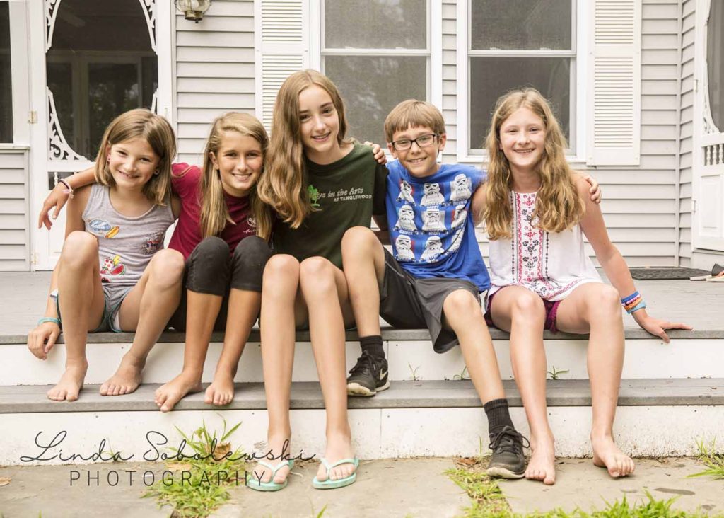 children sitting on a porch on a summer afternoon, Westbrook family photographer