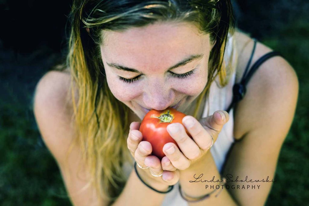 girl holding a summer tomato, Westbrook ct photographer
