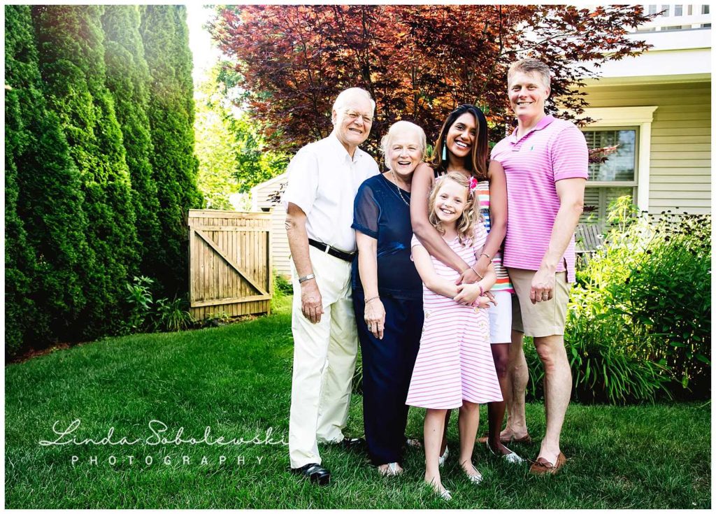 parents, grandparents and little girl smiling, extended family session, Madison ct family photographer