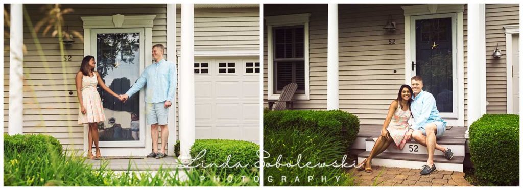 couple sitting and standing on the front porch of their new home, father's day session