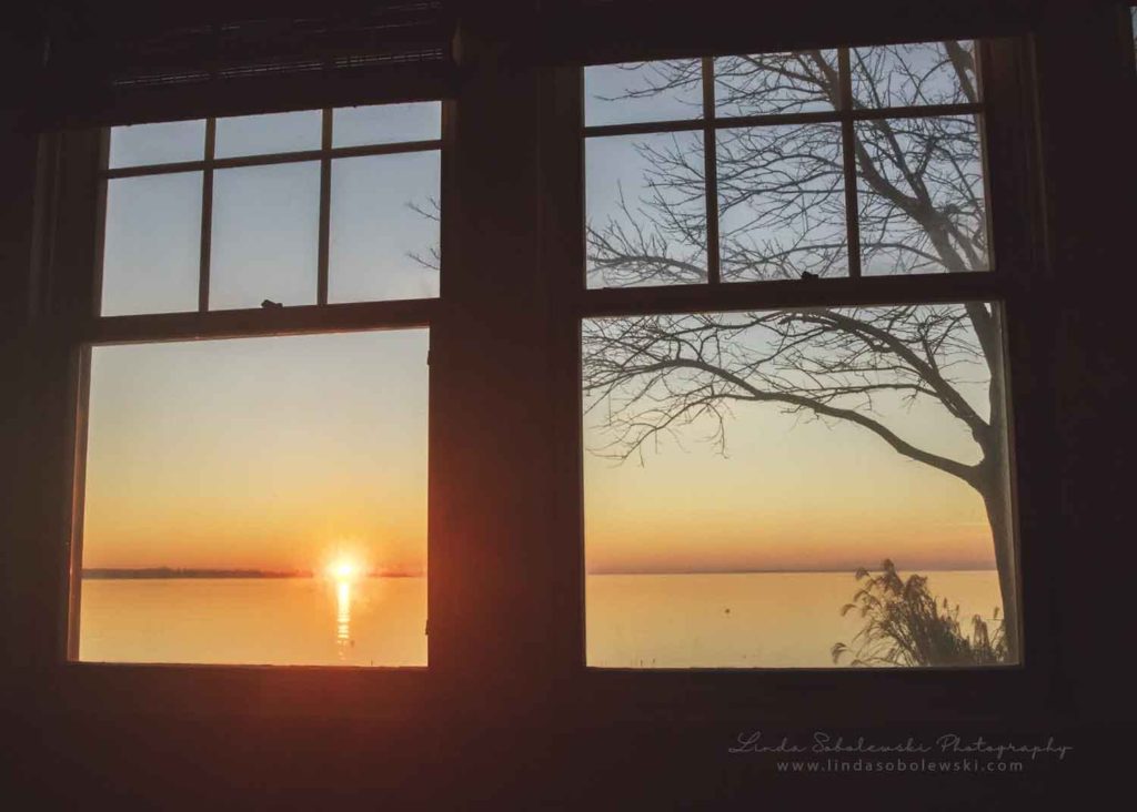 sun rise over the ocean, view from a window Westbrook photographer