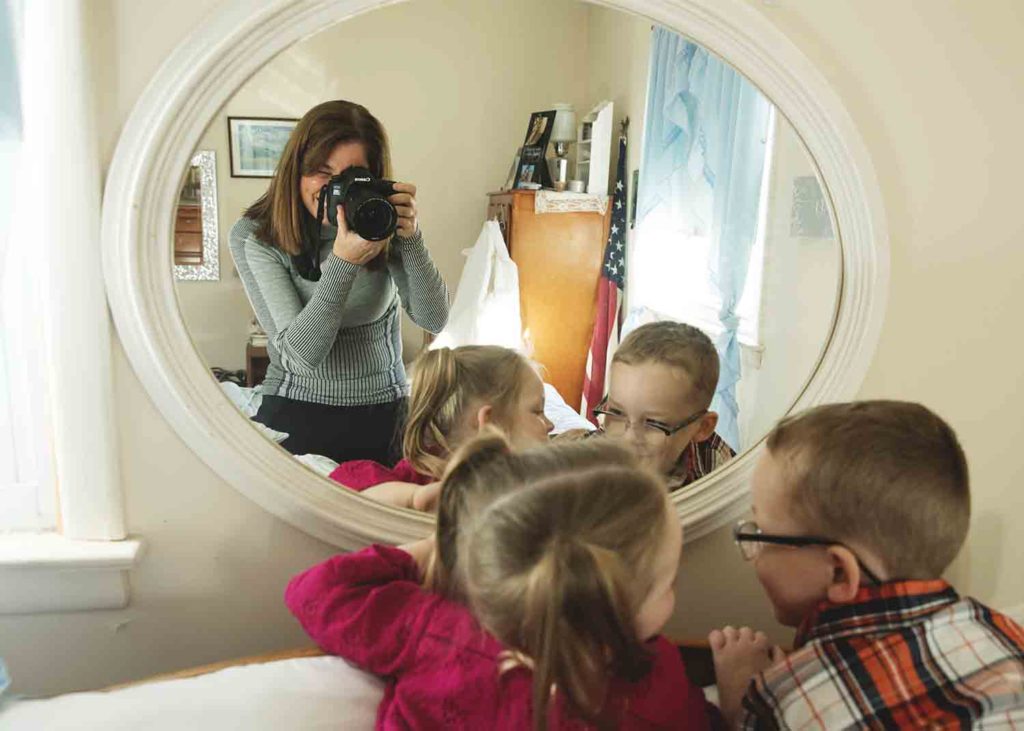 photographer taking photo in mirror of two children, Westbrook ct photographer