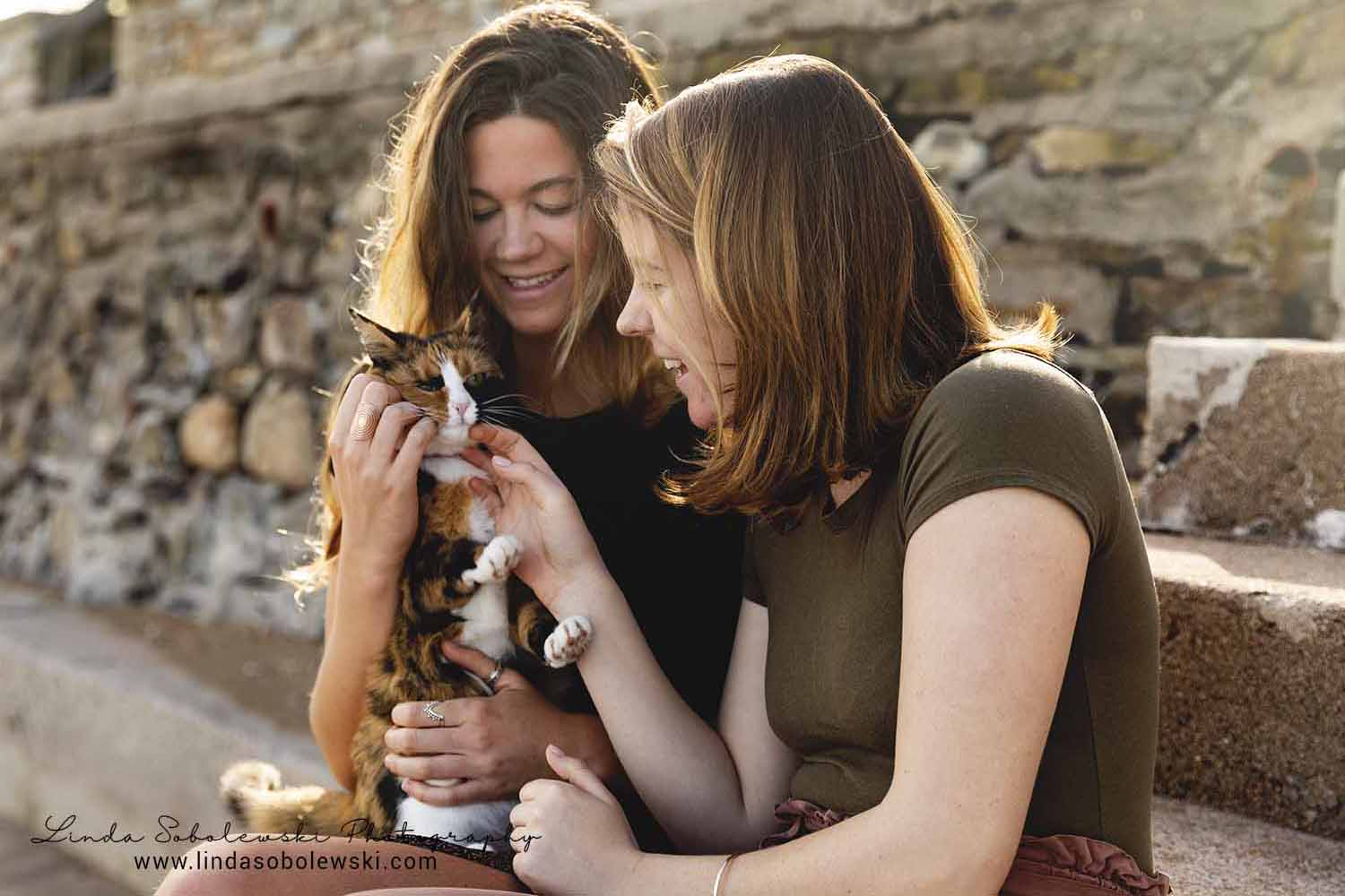 two girls petting a cat, Westbrook family photographer, project 52 - connections