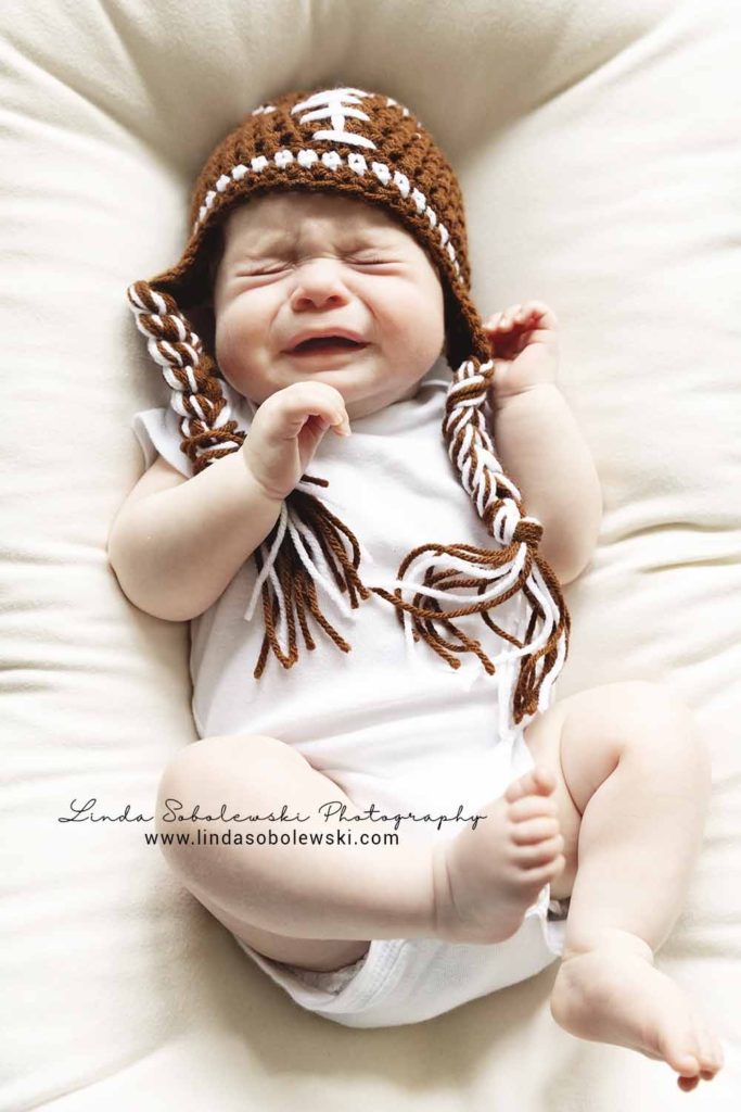 3 month old baby boy with hat, crying, branford baby photographer