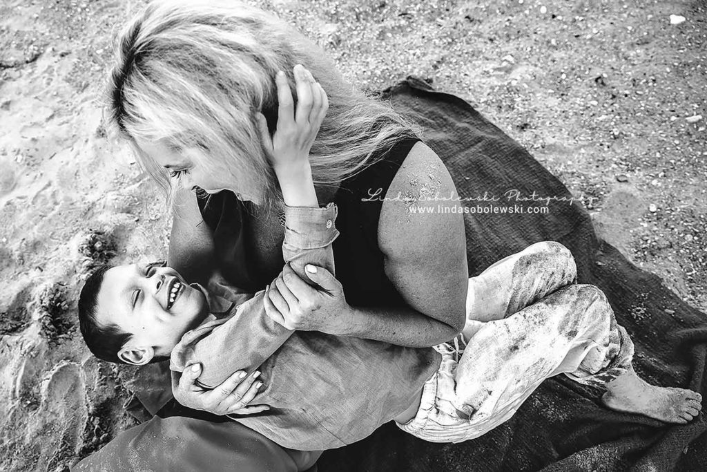 black and white image of mom and her son at the beach, old Saybrook ct family photographer