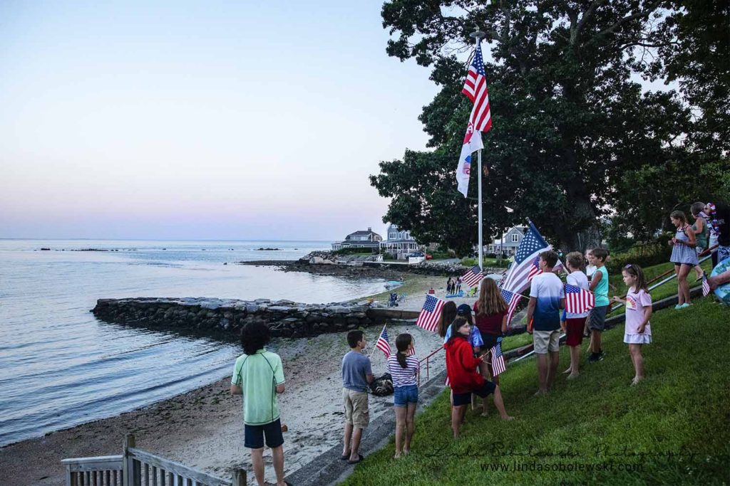 children around the flag on the 4th of July, chapman beach, westbrook photographer