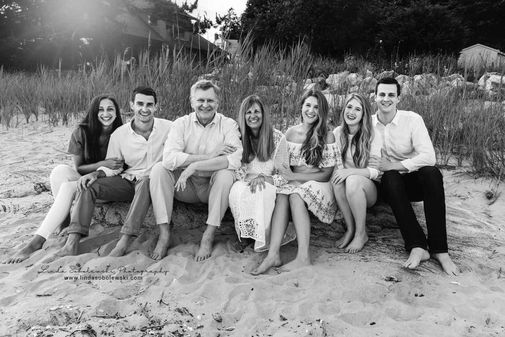 black and white image of family of six at water's edge, westbrook ct photographer