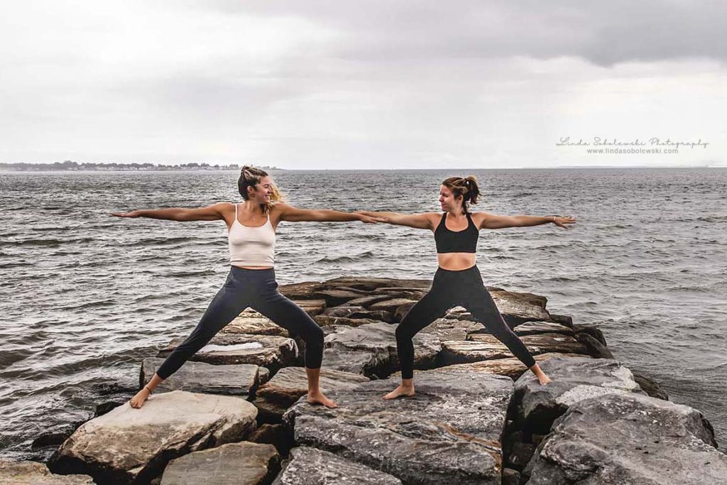two girls doing yoga on the rocks at the beach, westbrook ct photographer, august 2019