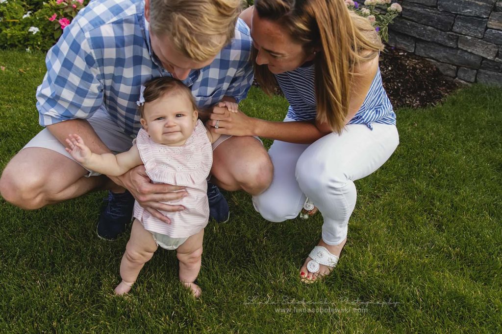 baby girl being held standing by her parents, extended family portraits, westbrook ct photographer