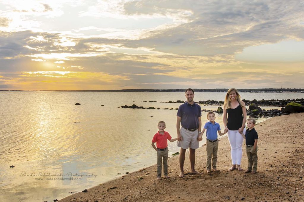 family walking on the beach during sunset, connecticut family photographer
