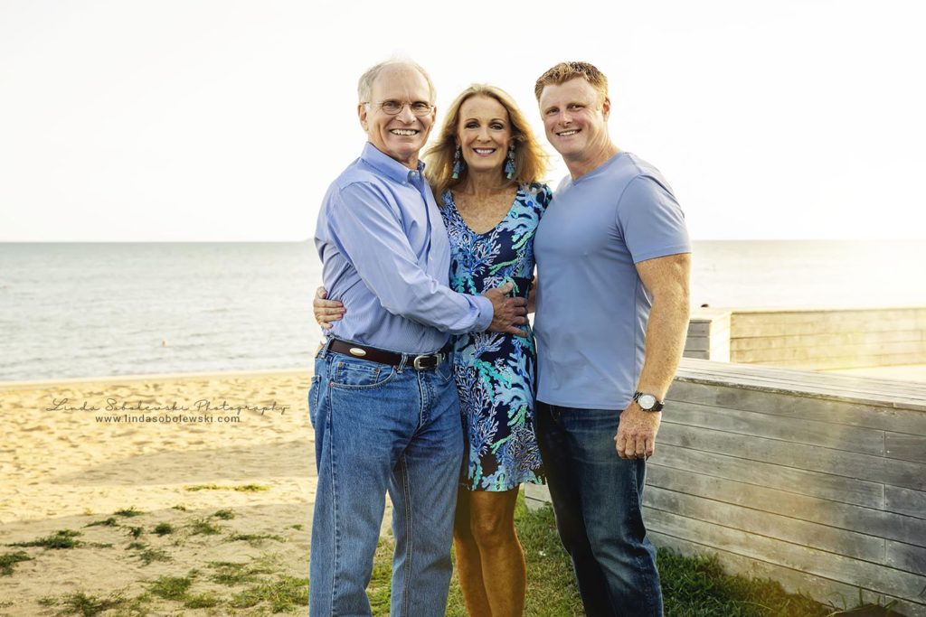 family posing at the madison surf club, ct family photographer