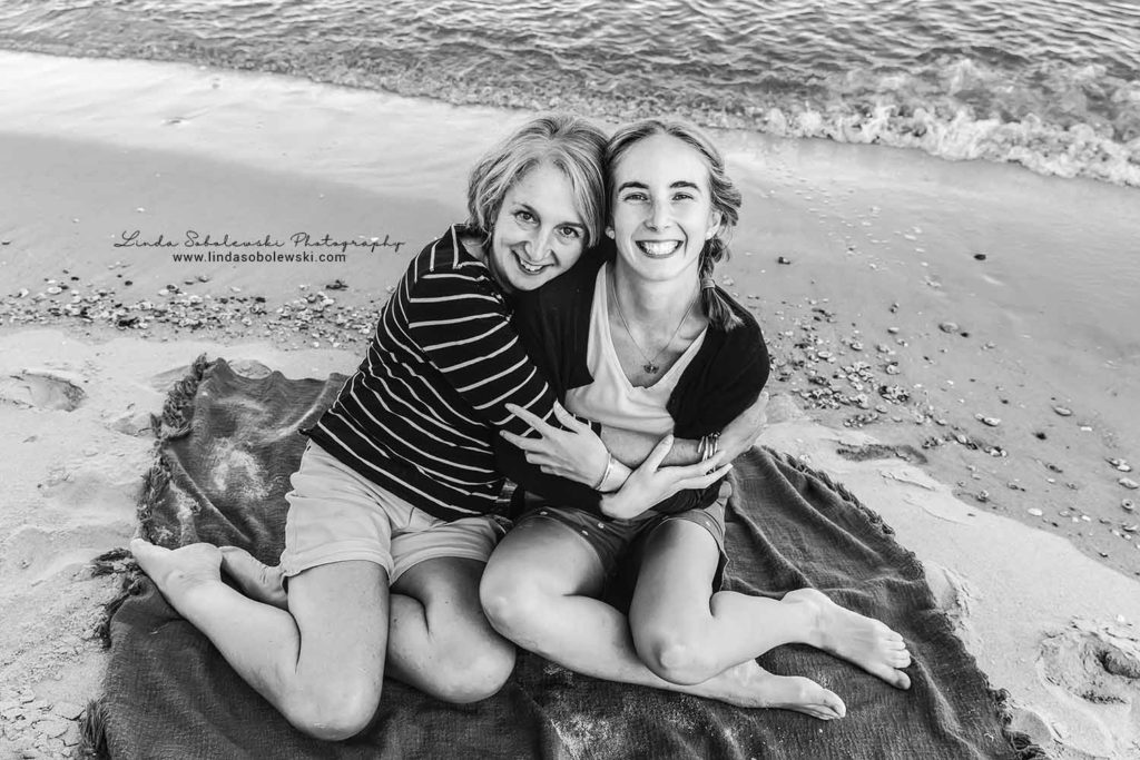 black and white image of mom and daughter at the beach, family photo session