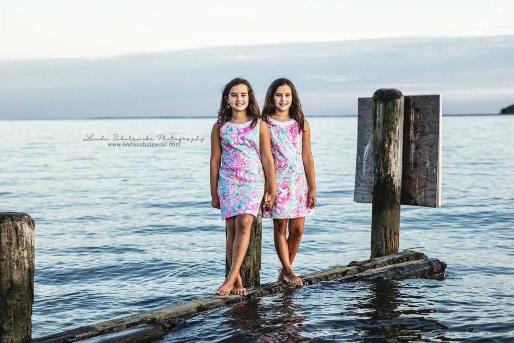 twin girls at the beach during the sunset in Westbrook, CT, photo session