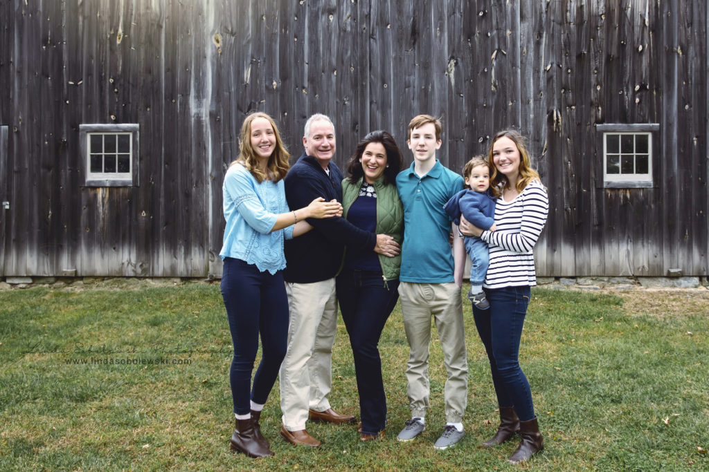family of five posing for a fall family photo session, Old Saybrook, CT photographer