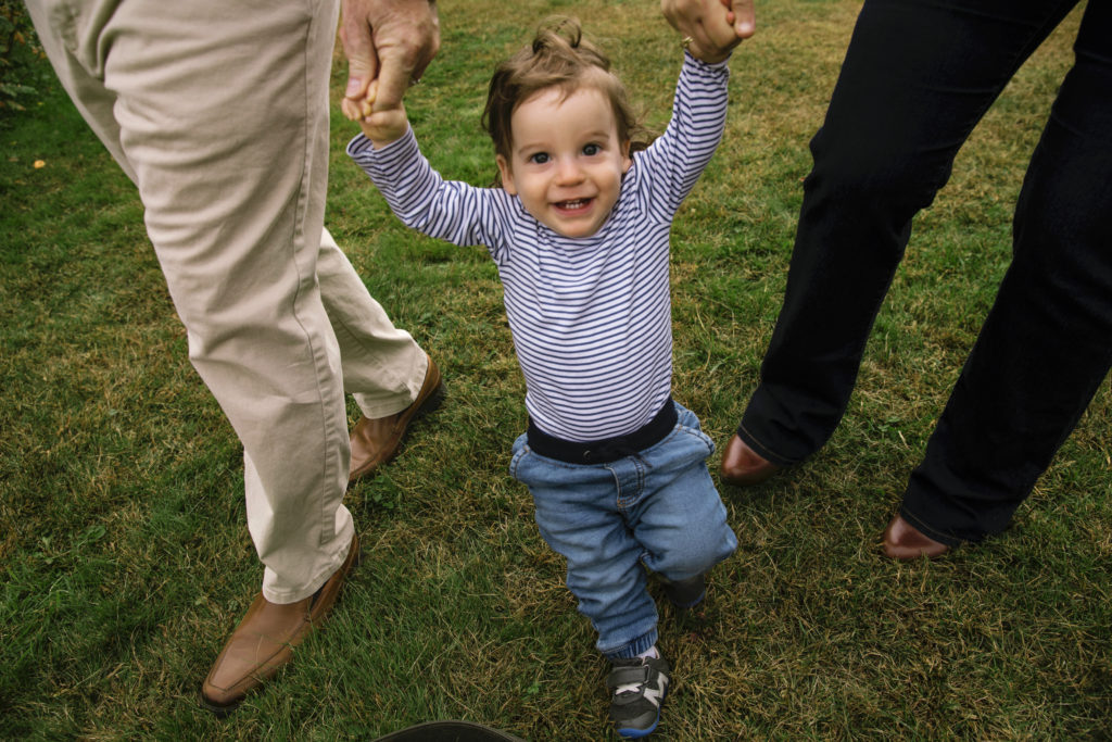 two year old boy holding his parents hands, Madison CT Family photographer
