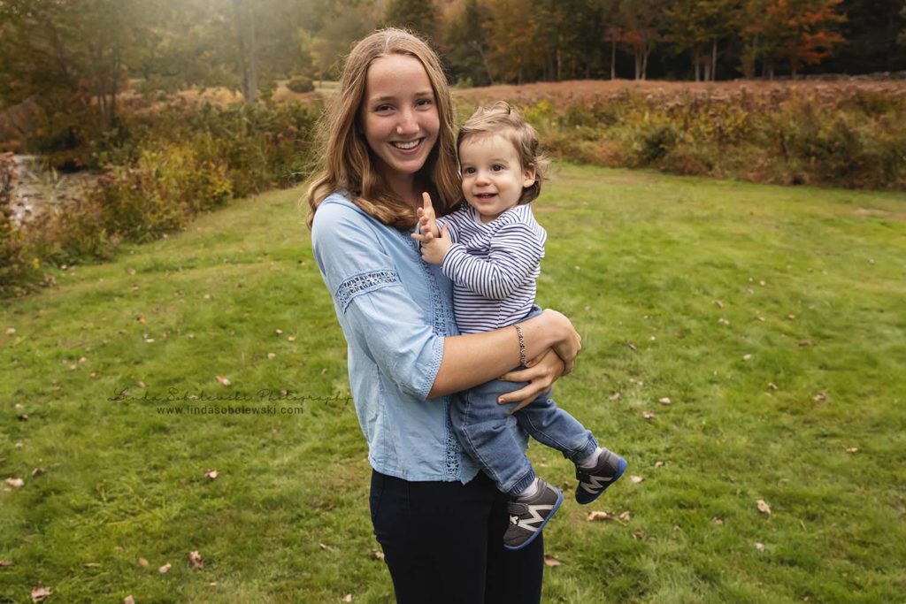teenage girl holding her toddler baby brother, Guilford CT photographer