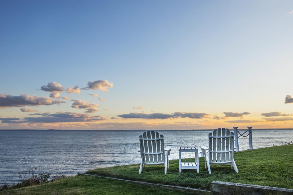 two white adirondack chairs facing the ocean as the sun is setting, personal project for Linda Sobolewski - Project 52 - negative space, November 2019