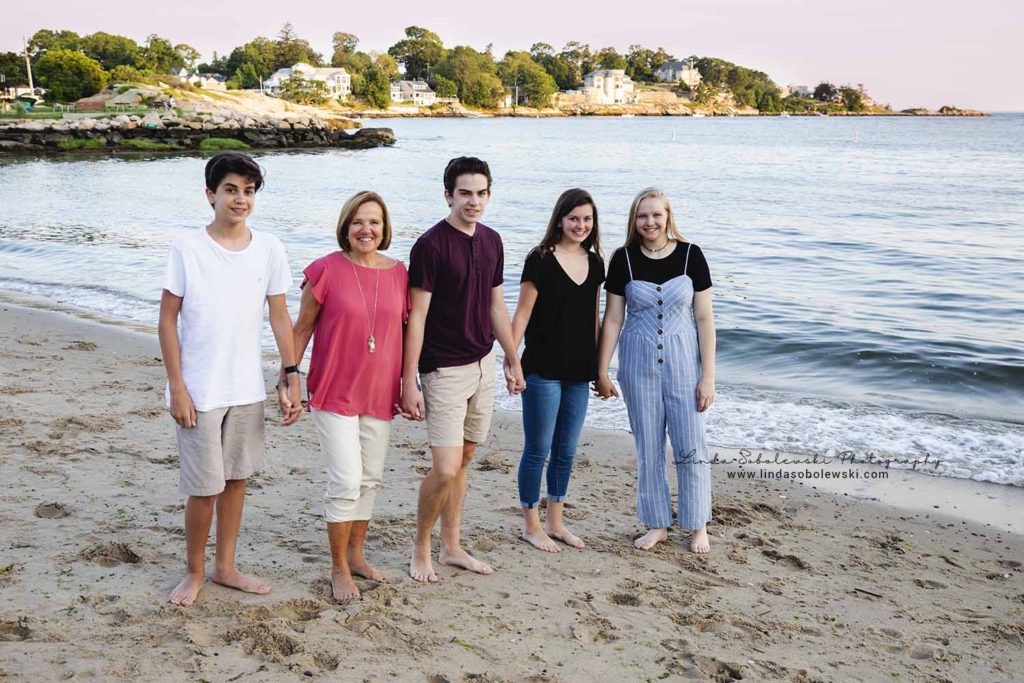 family of five walking on the beach, Branford, CT lifestyle photographer