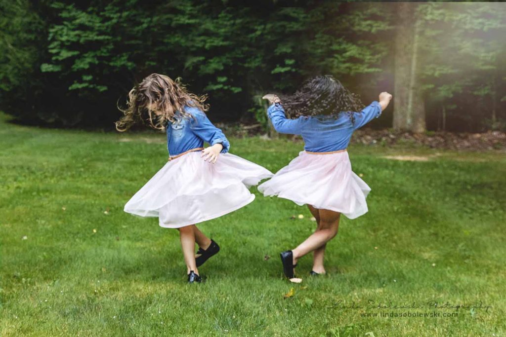 little girls with pink tulle skirts spinning around, Connecticut Family Photographer