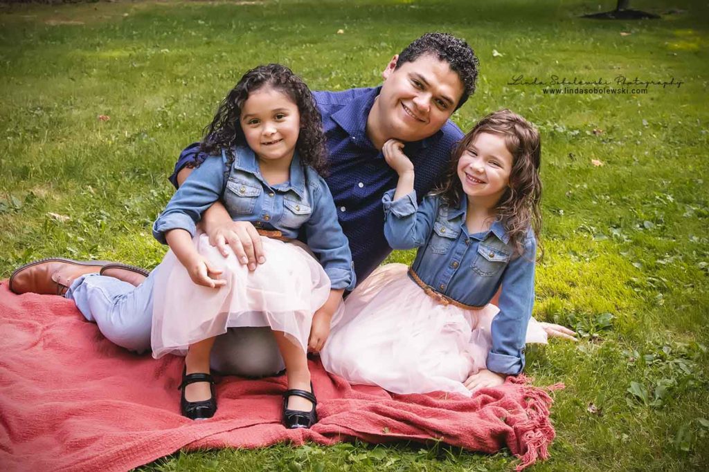 dad sitting with his twin girls on their lawn, Guilford CT Family of Five Photography Session