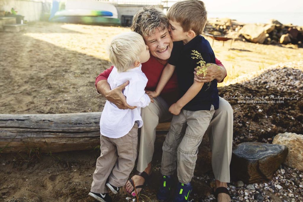 grandchildren kissing their grandma at the beach, Old Saybrook Family Photography Session