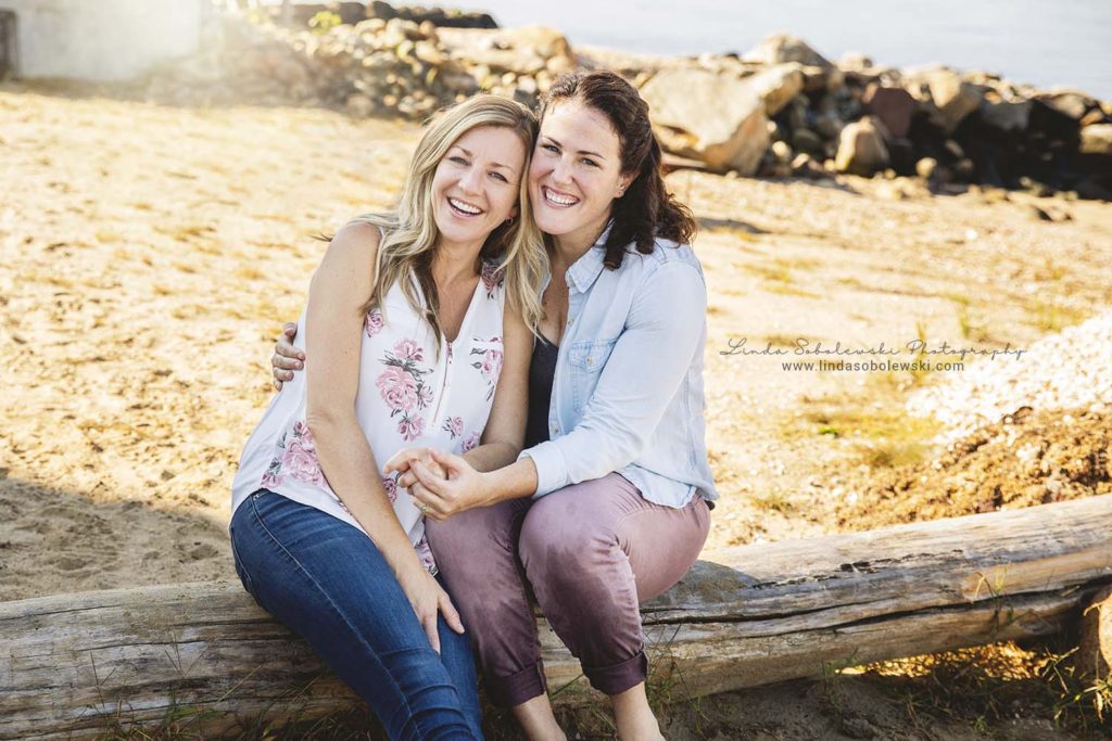 two girls sitting on a log, Connecticut Couples Photographer
