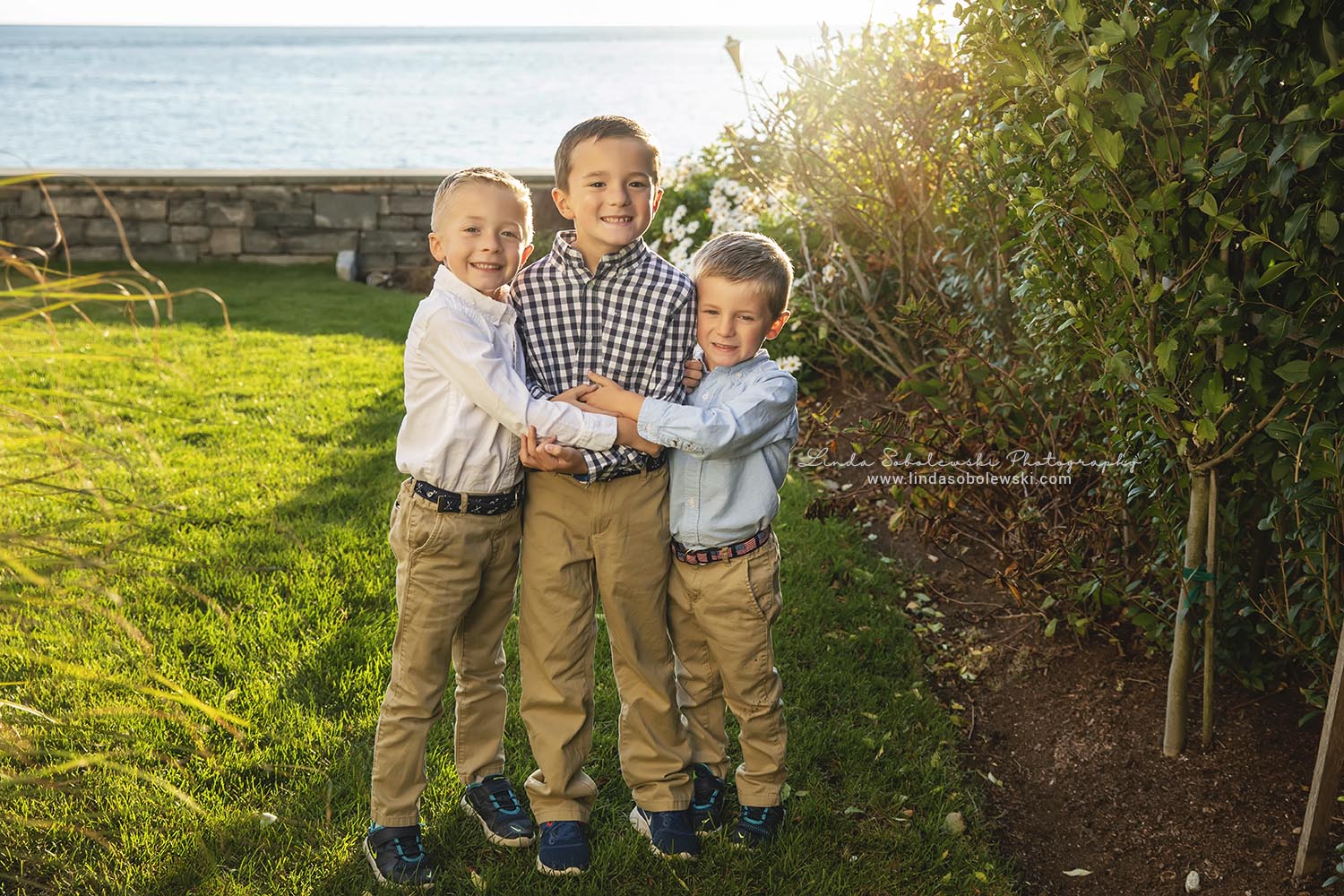 three brothers smiling for a family summer photo session, Old Saybrook Connecticut photographer