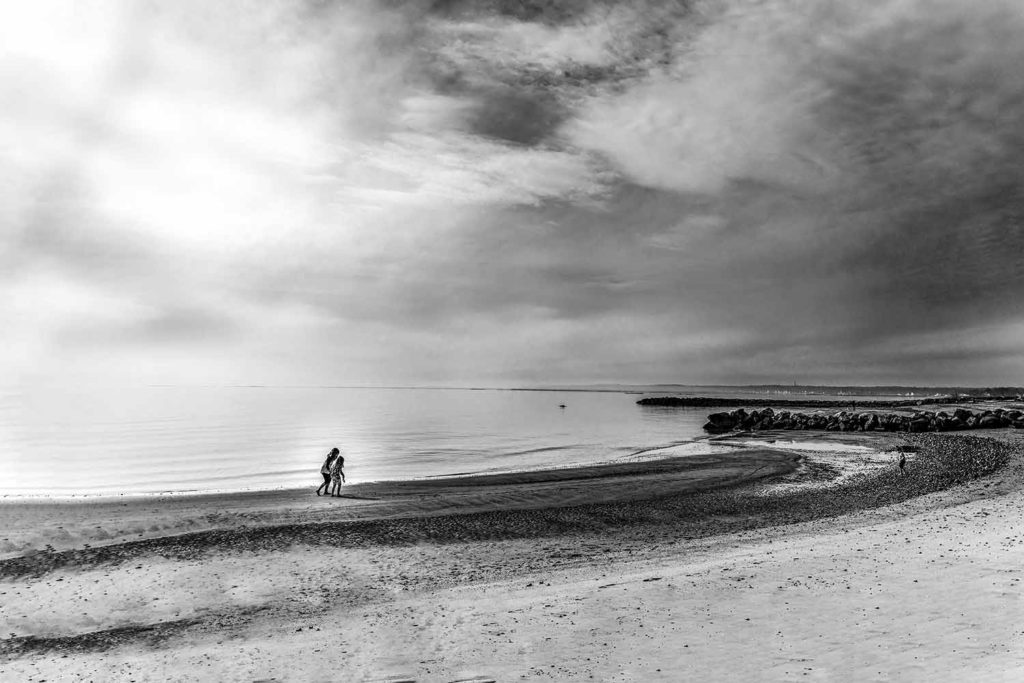 black and white image of a cloudy beach, March, 2020 blog post for Linda Sobolewski Photography, CT family photographer