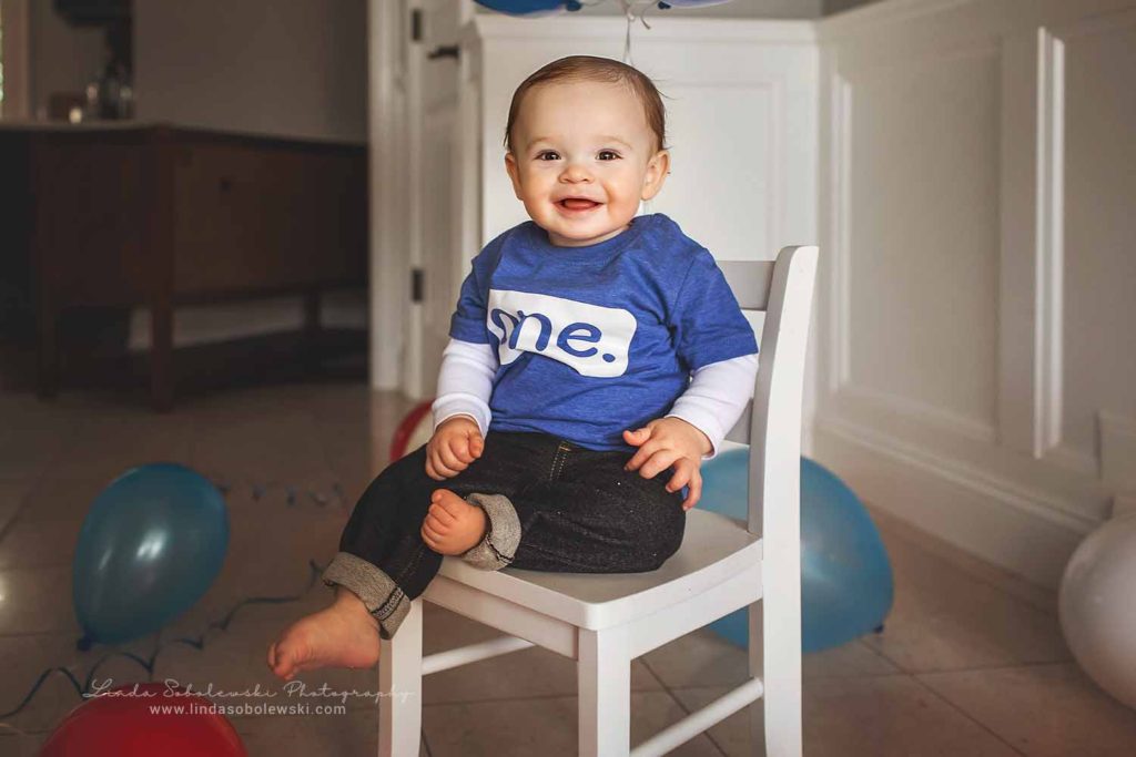 Baby Boy's First Birthday Session, little boy sitting in a white chair. Branford CT photography session