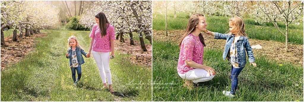mom in pink shirt and her little girl in an apple orchard, CT shoreline family photographer