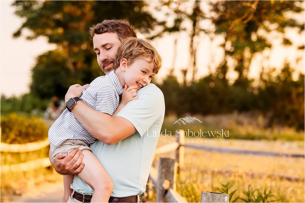 dad playing with his little boy, Madison CT senior and newborn family photographer