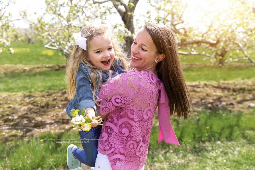 mom in pink shirt laughing with her little girl, Spring Photo Session, Old Saybrook, CT Family photographer