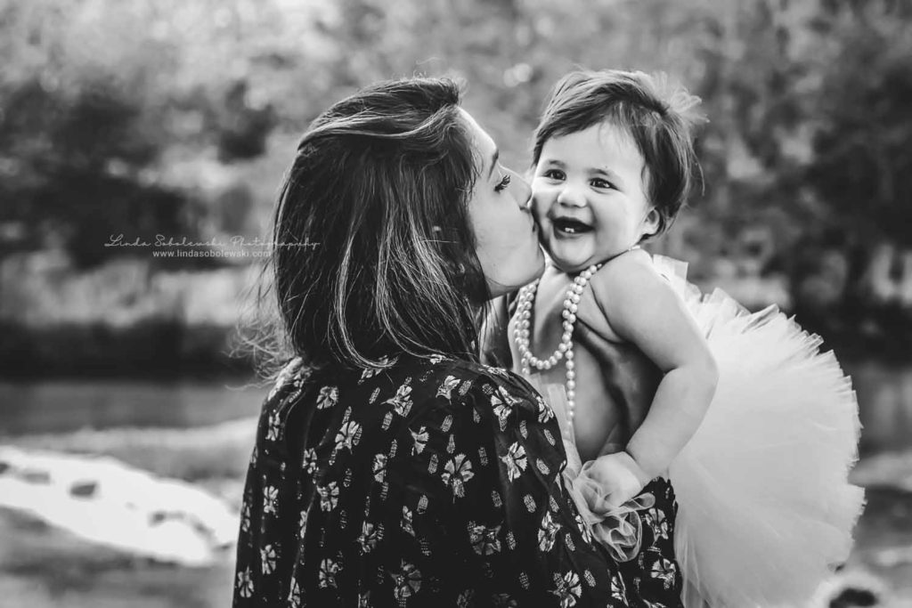 black and white image of mom holding baby, one-year-old baby pictures, Connecticut Lifestyle and Family Photographer