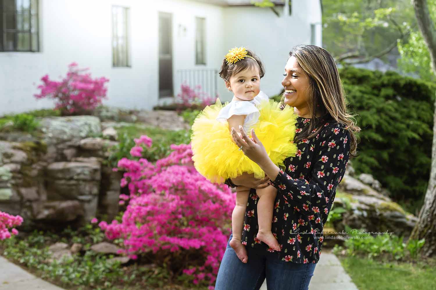 mom holding her baby in yellow tutu, Connecticut Shoreline Photographer