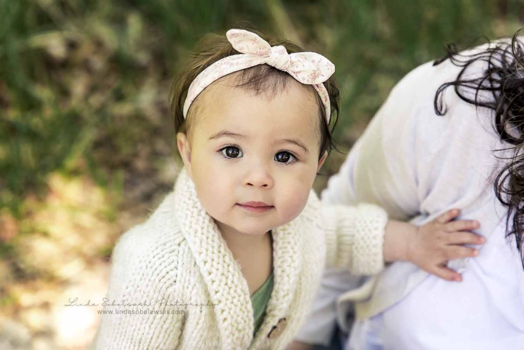 baby girl with white bow and brown eyes, Connecticut Baby Photographer