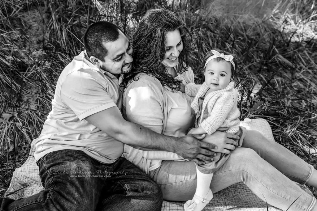 black and white image of parents smiling at their one year old baby girl, Connecticut Baby and Child Photographer