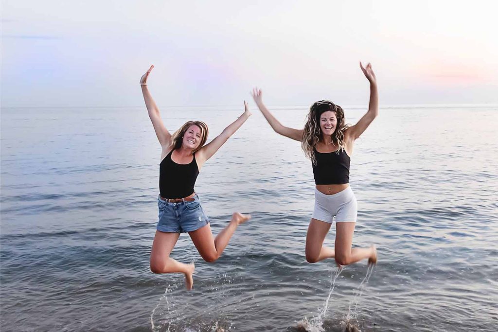 two girls jumping in the air, July 2020 personal project for Connecticut Family Photographer