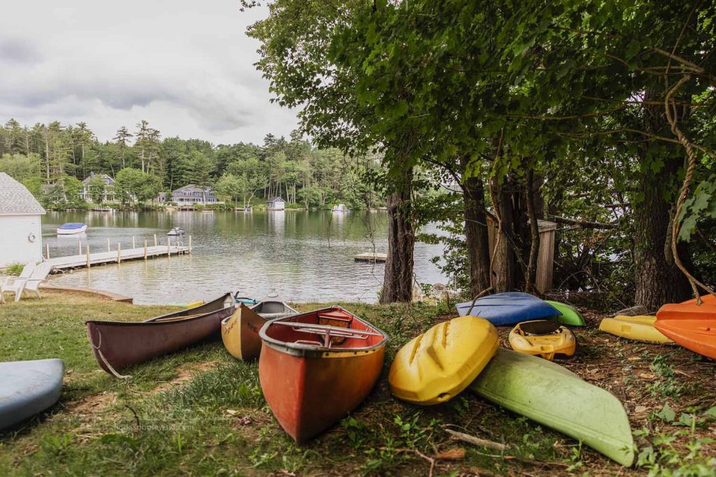 kayaks on the ground next to the lake, Weekend getaway for a Connecticut Family Photographer