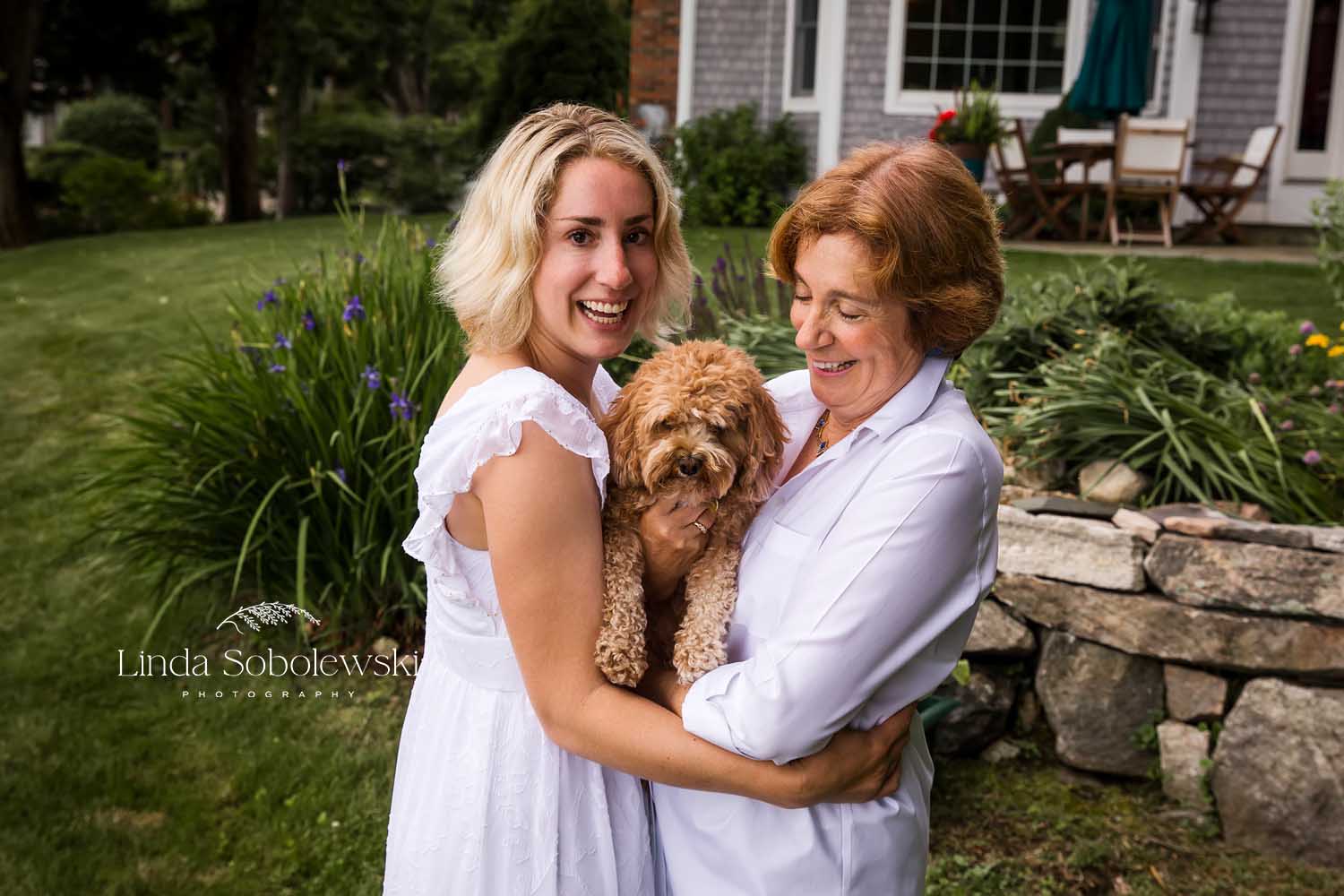 adults holding a dog, Mystic Family photographer
