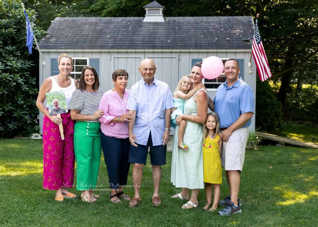 adult siblings and cousins laughing together, CT shoreline photographer