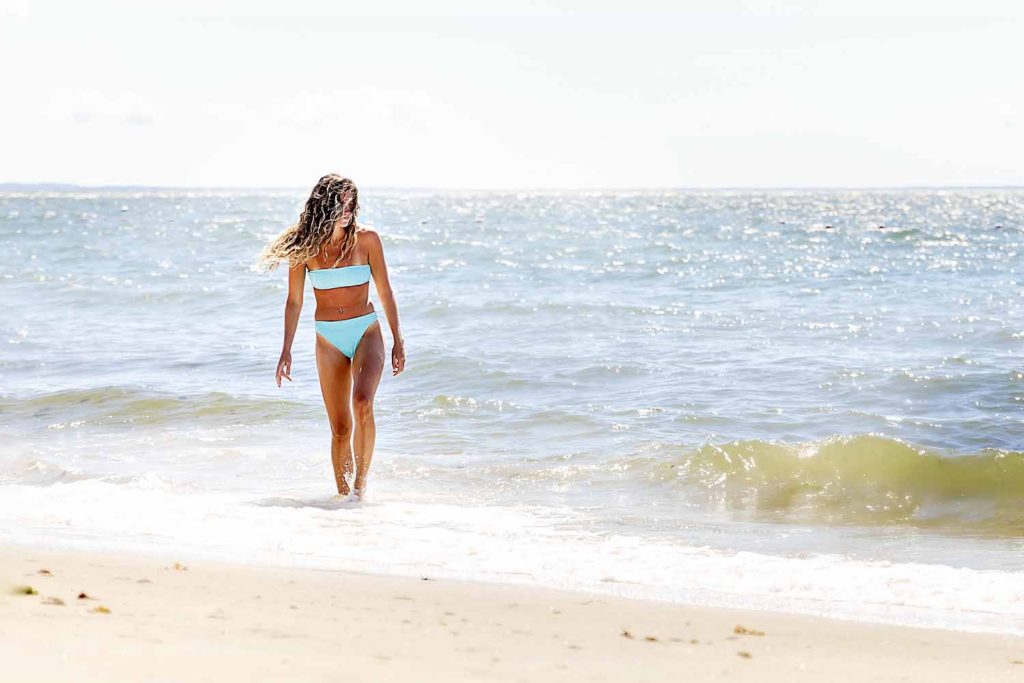 girl in blue bathing suit walking on beach, august 2020 personal photography project