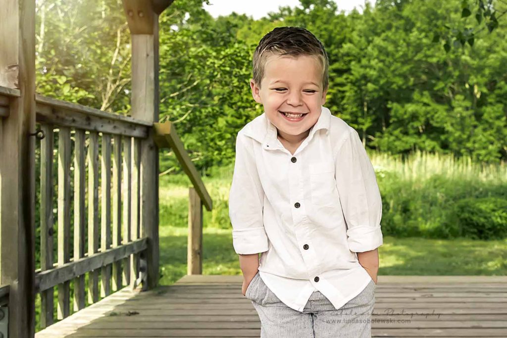 cute little boy in white shirt smiling, Madison, CT Family photographer