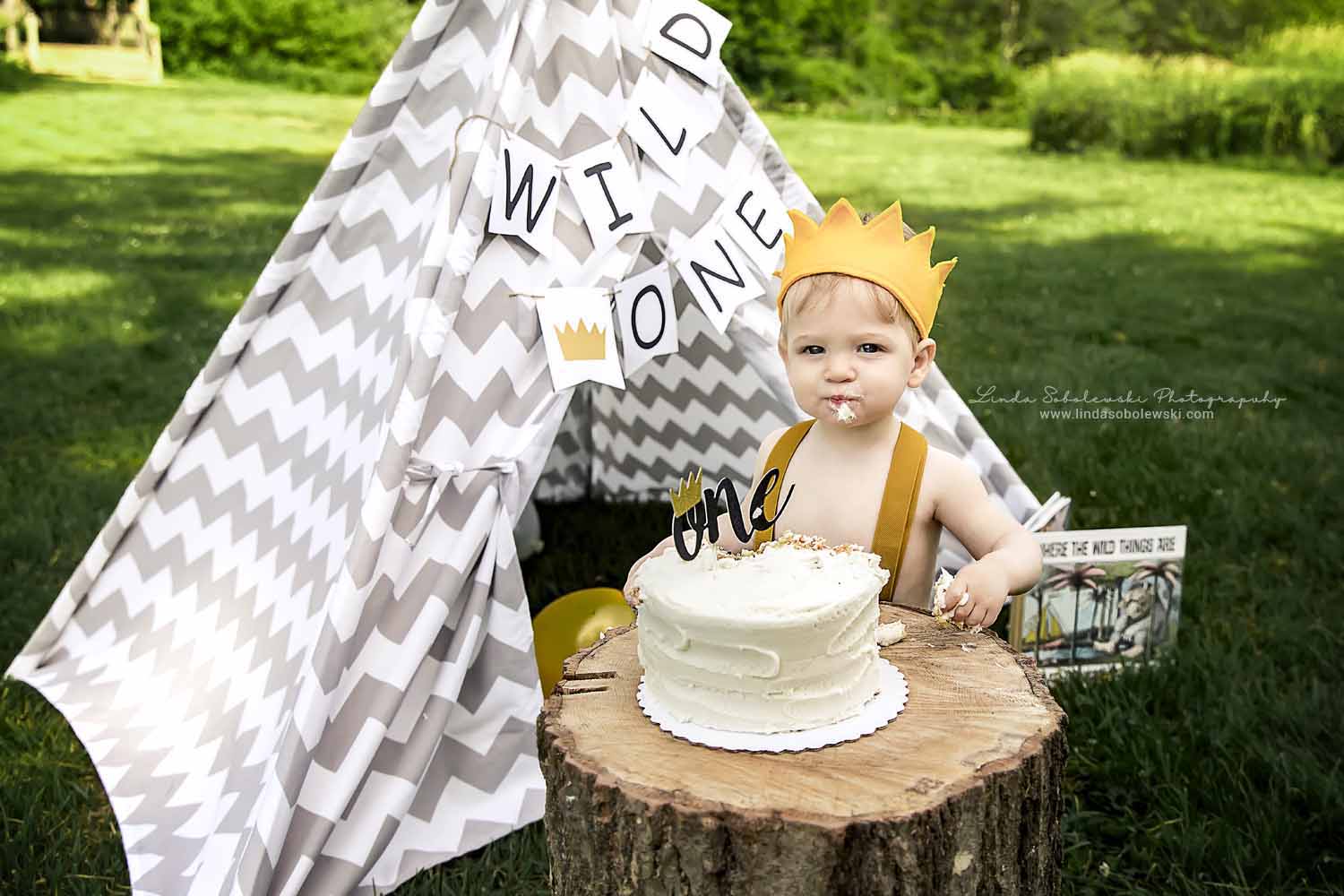 little boy eating cake at his one year old photo session, Madison, CT photographer