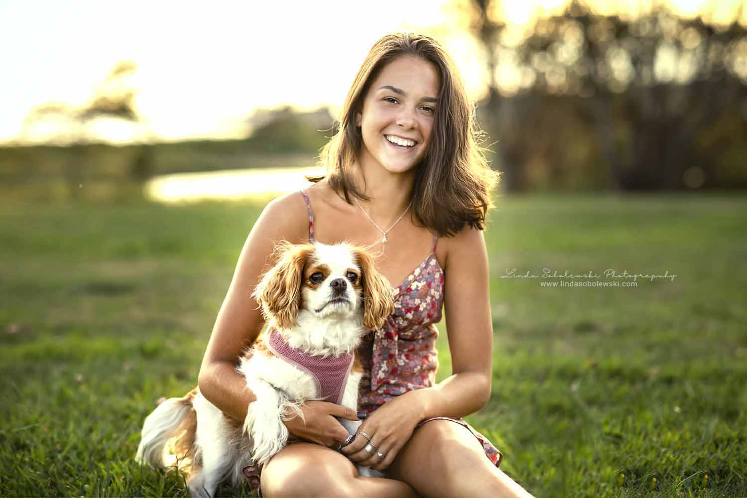 girl holding her dog in a park, CT photography session