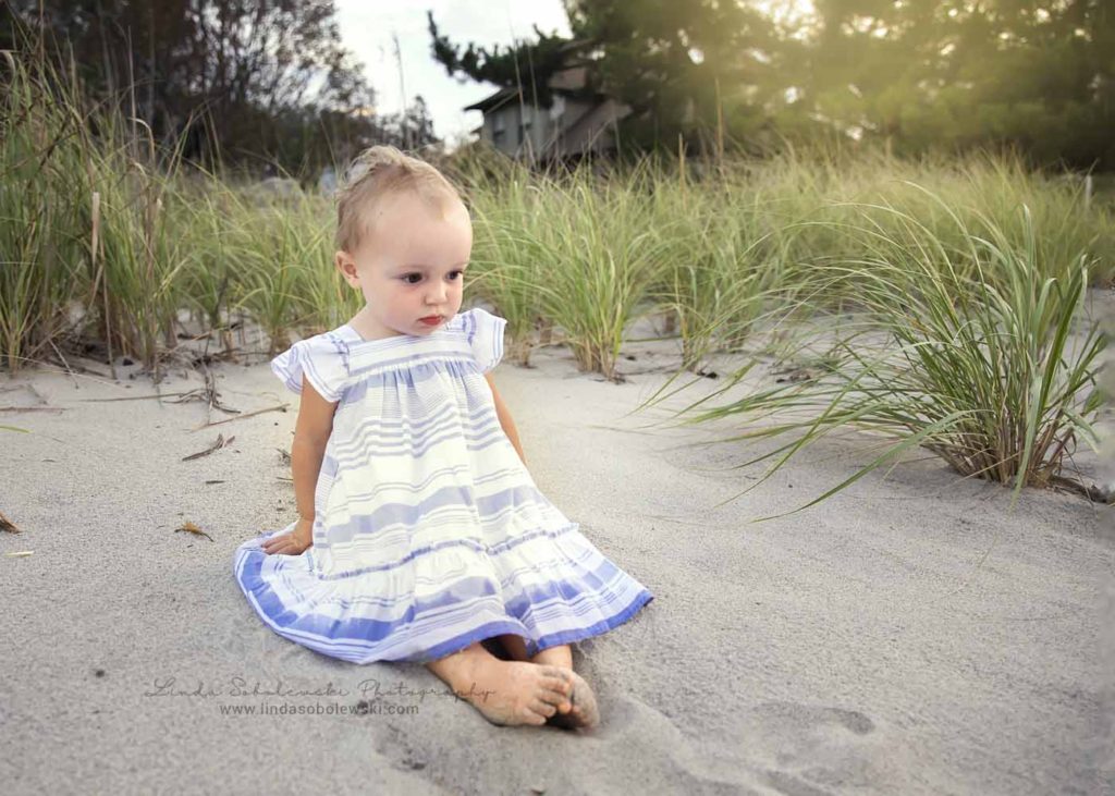 baby girl sitting on the beach, CT Shoreline beach photographer