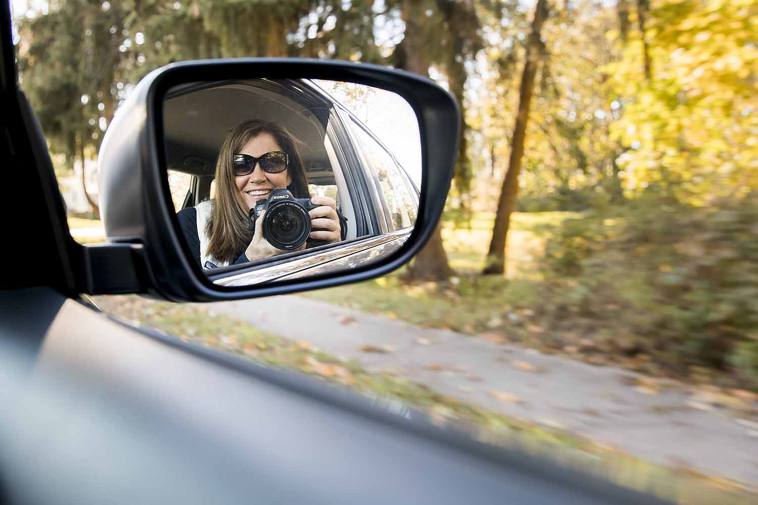 woman taking her photos in a rearview mirror, November and December personal project for Old Saybrook, CT photographer