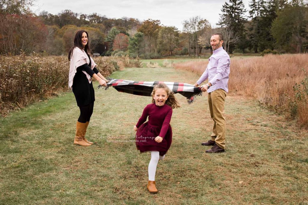 parents playing with their little girl, CT Fall Family Photo Session
